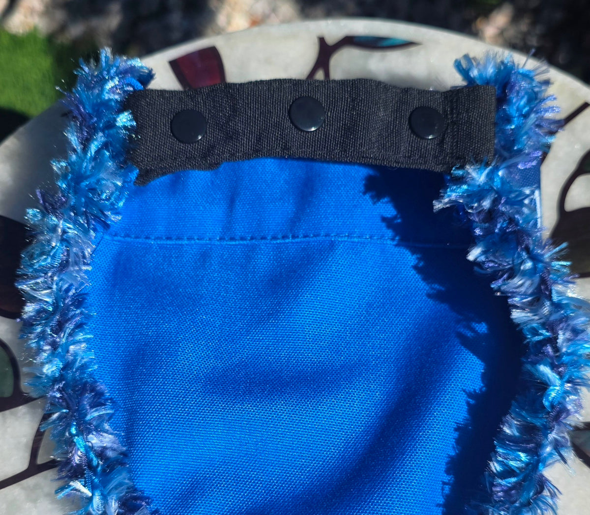 Sloppy Kisser Dog Bandana, flat back view showing solid blue reverse and snap-on collar strap
