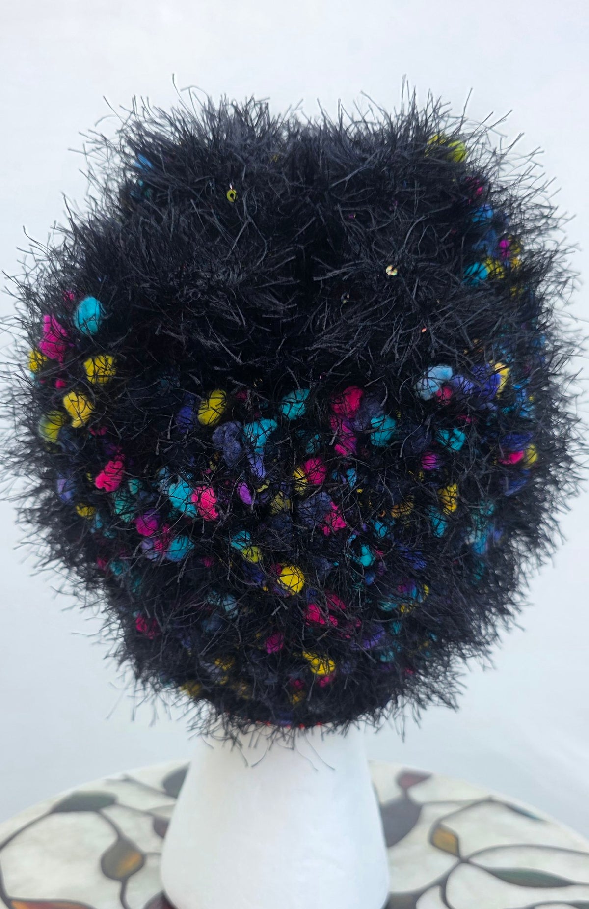 Confetti Queen crown hat on mannequin, white background