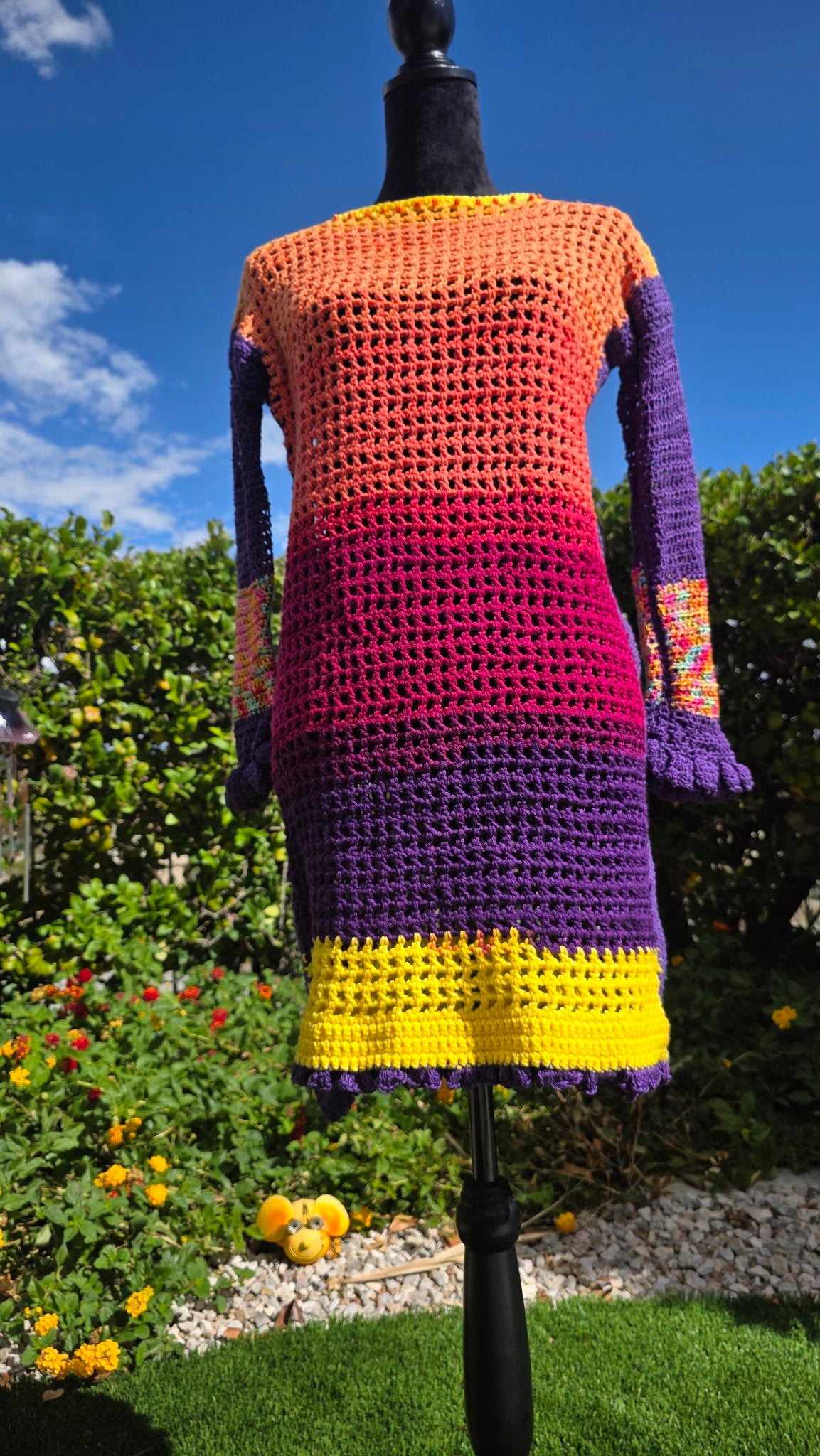 Spectrum Sunset crochet dress on mannequin — front view