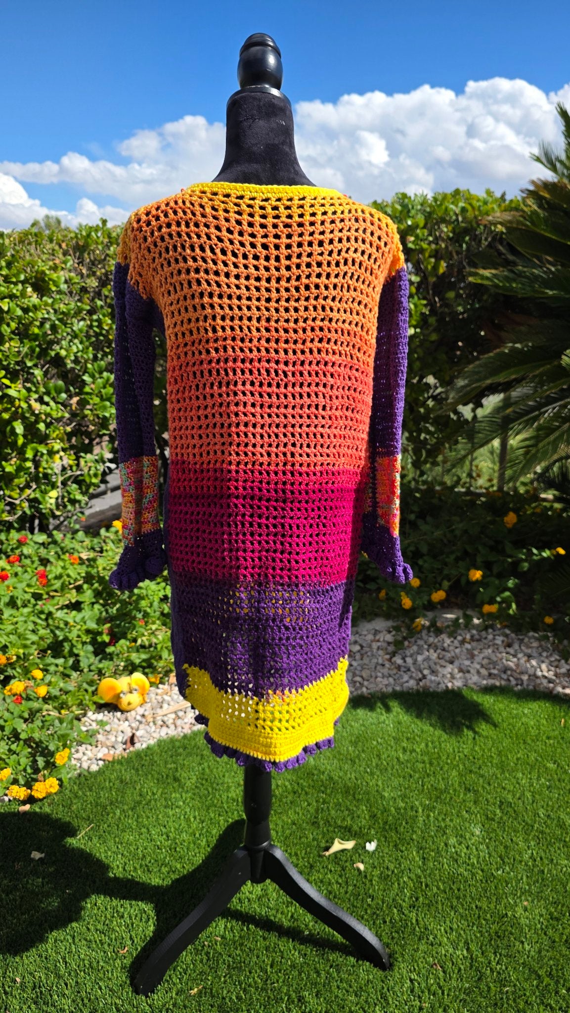 Spectrum Sunset crochet dress on mannequin — back view