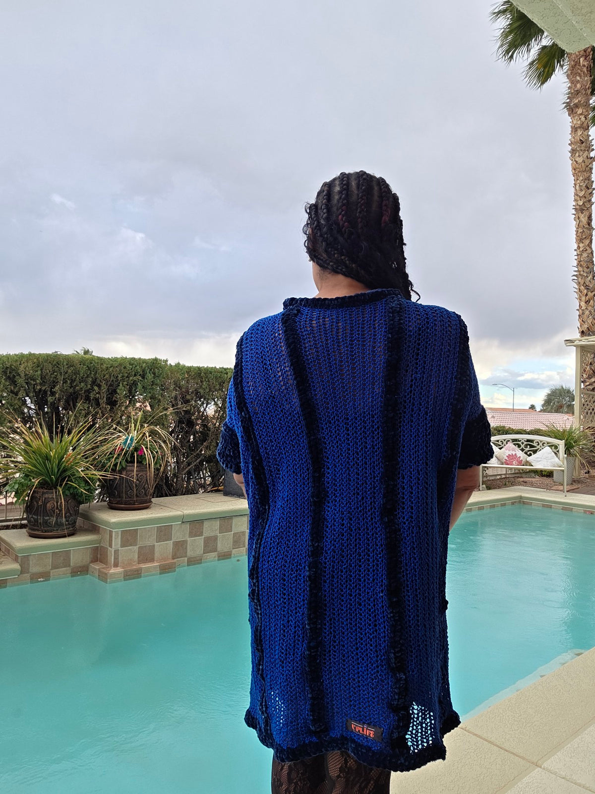 Cobalt Water tunic dress worn by Empress Vida — back view with UPLIFE label
