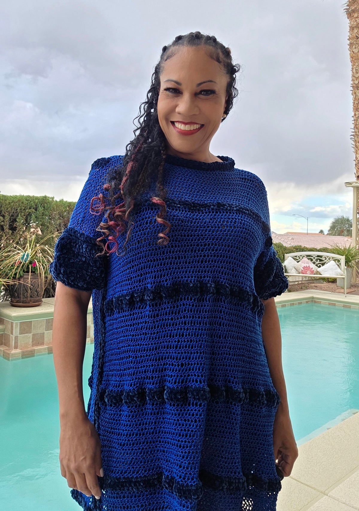 Cobalt Water tunic dress worn by Empress Vida — front view, poolside