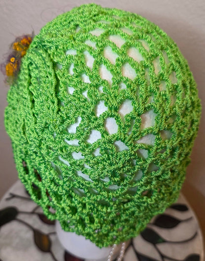 Verde Bloom Hat top view — radial openwork crochet pattern
