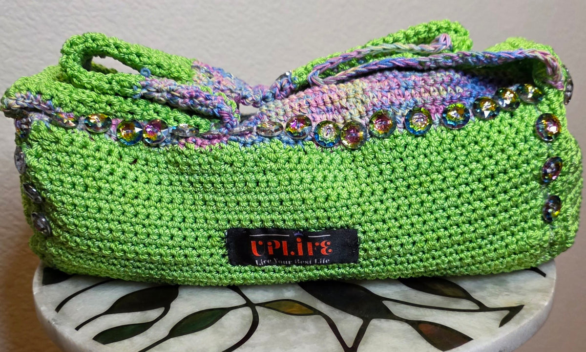 Verde Purse front — lime-green crochet with iridescent glass buttons and UPLIFE label