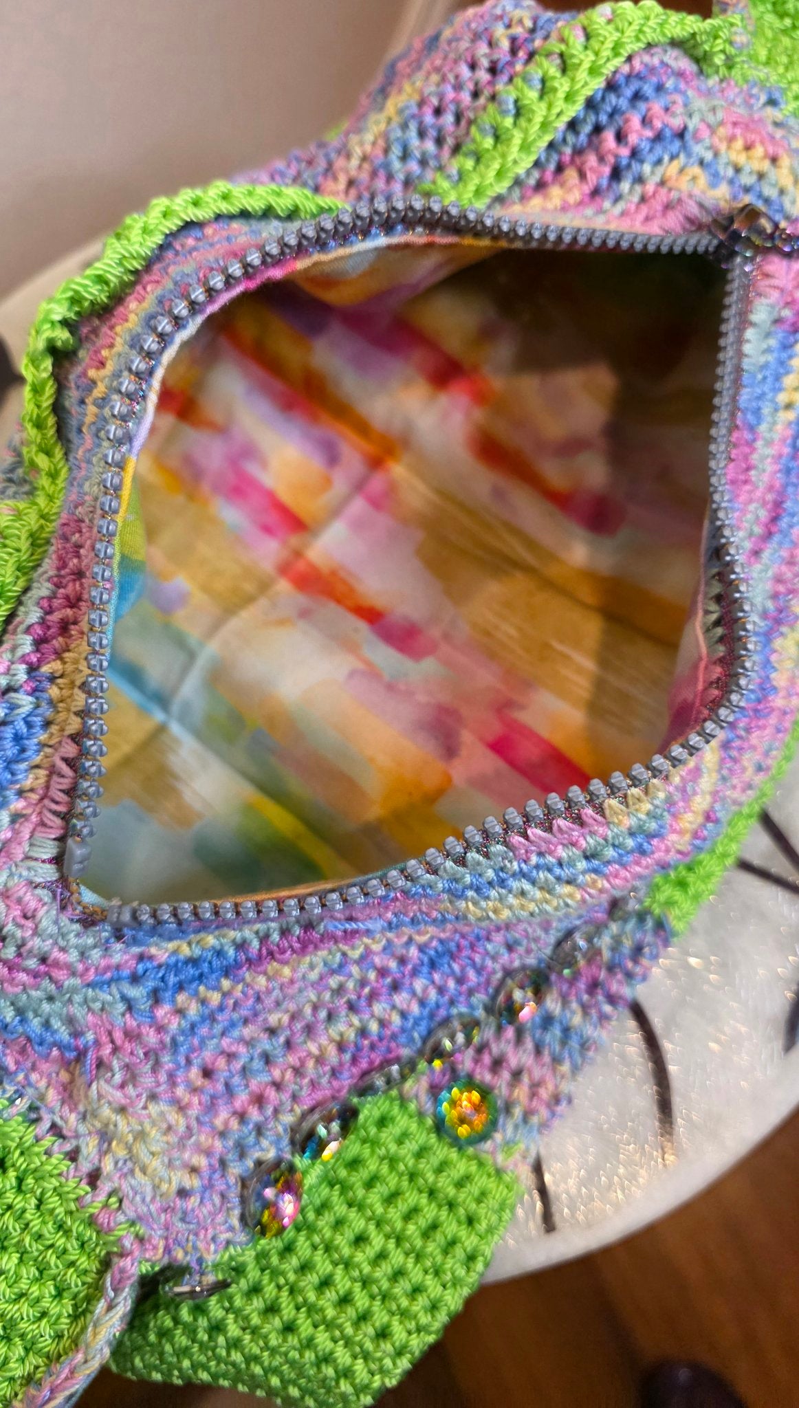 Verde Purse interior — zipper open, cotton pastel watercolor print lining