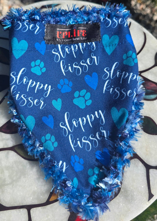 Sloppy Kisser Dog Bandana, flat front view showing blue hearts and paw prints, sloppy kisser script and sewn-in UPLIFE label