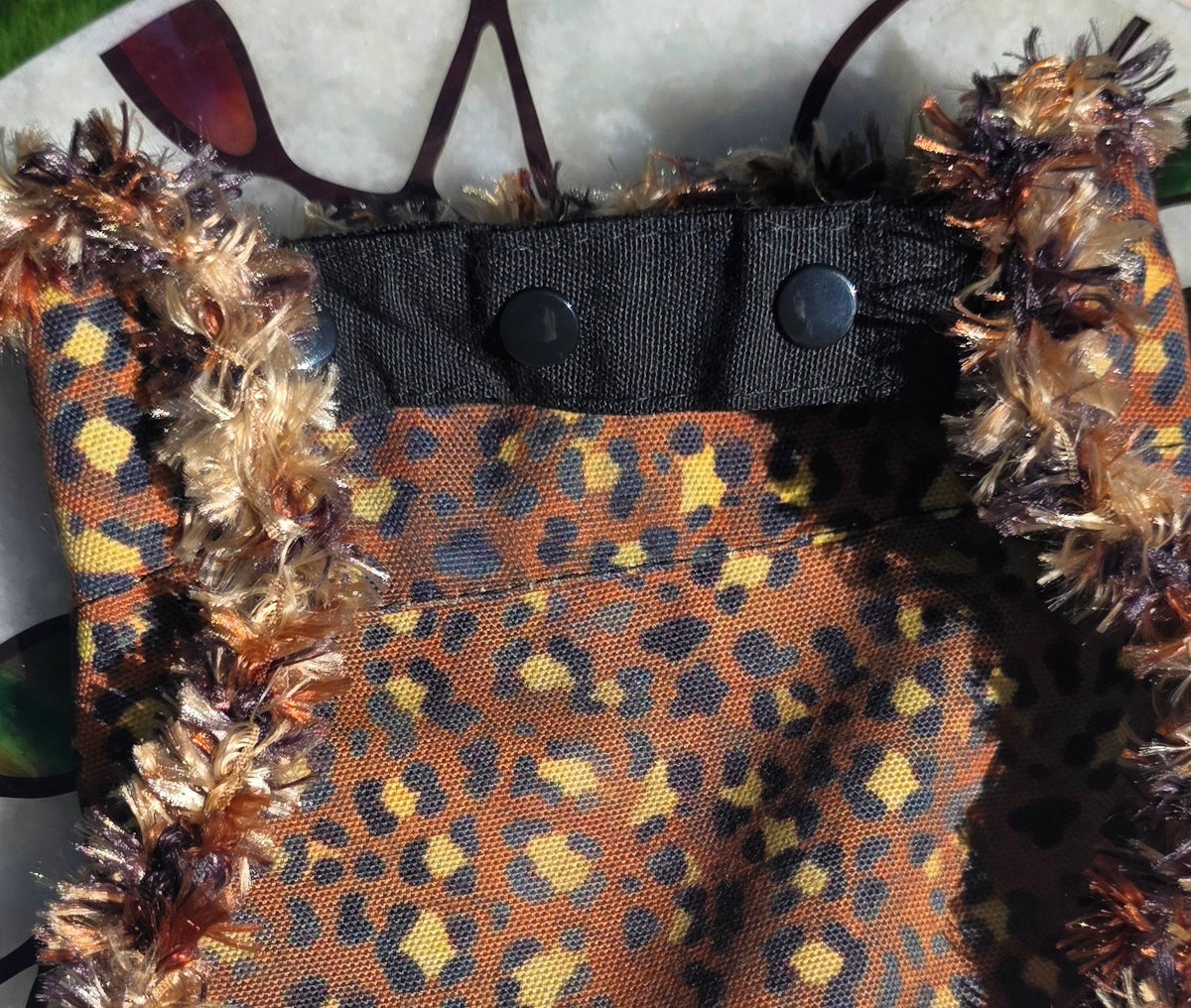 Fluffy NOT FAT Dog Bandana, flat back view showing leopard print reverse and snap-on collar strap