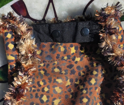 Fluffy NOT FAT Dog Bandana, flat back view showing leopard print reverse and snap-on collar strap
