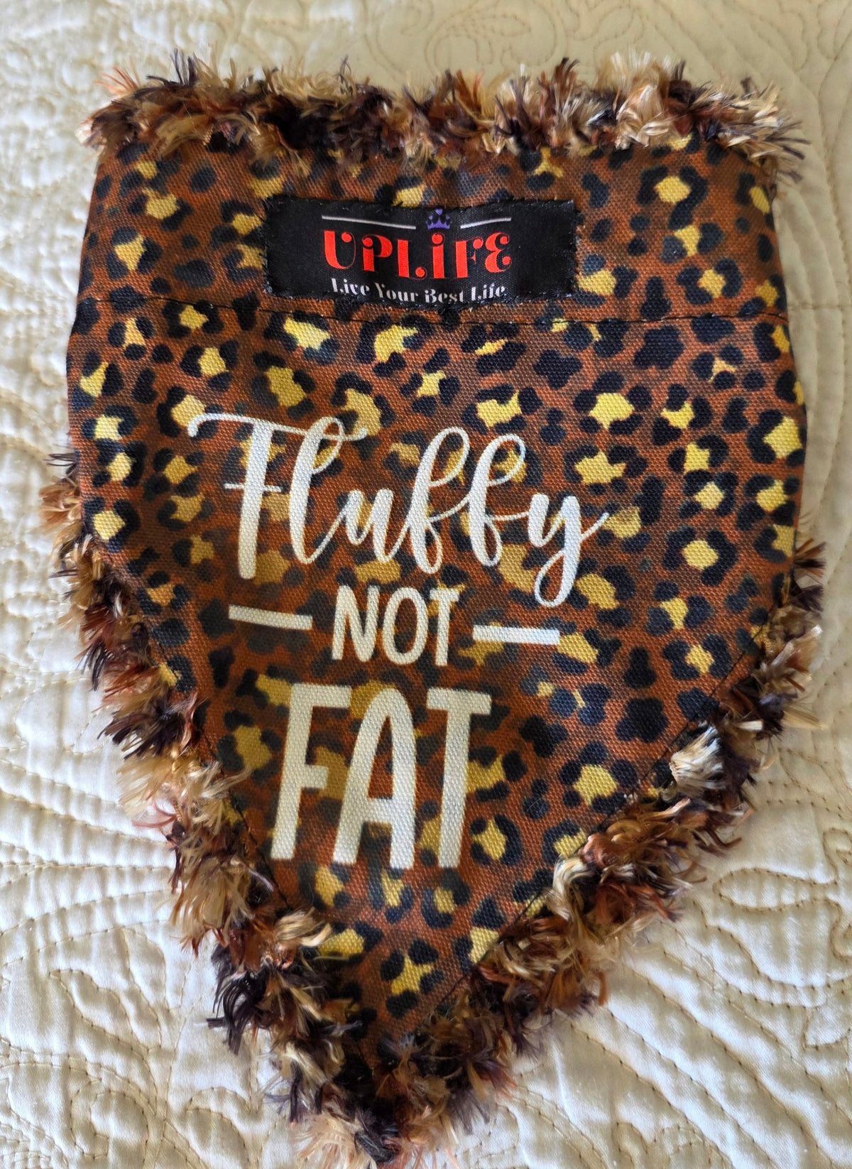 Fluffy NOT FAT Dog Bandana, flat front view on a light quilted background
