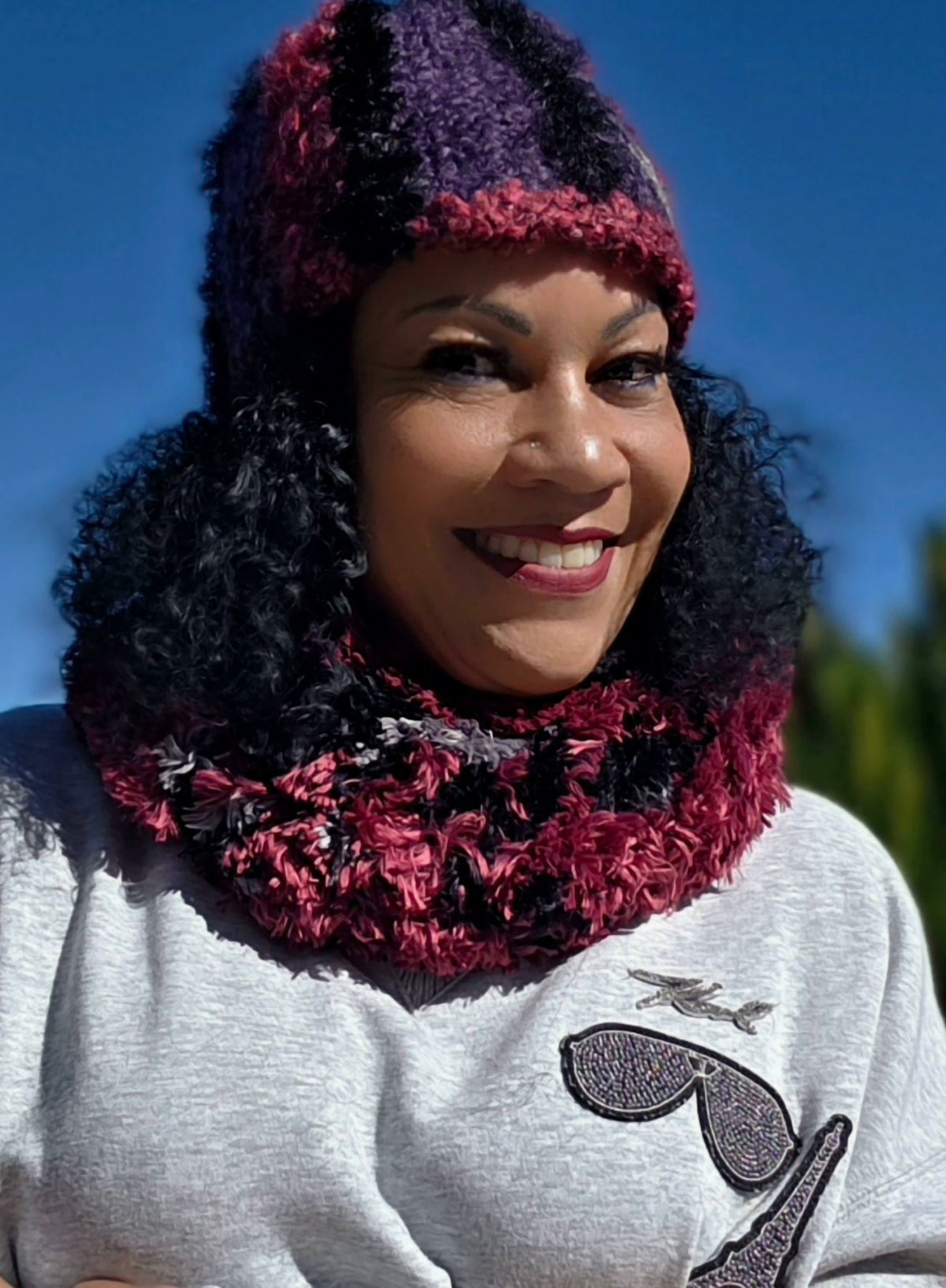 Empress Vida wearing the Amethyst Queen Infinity Scarf and Hat, three-quarter view