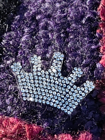 Close-up of the rhinestone crown applique on the Amethyst Queen Hat