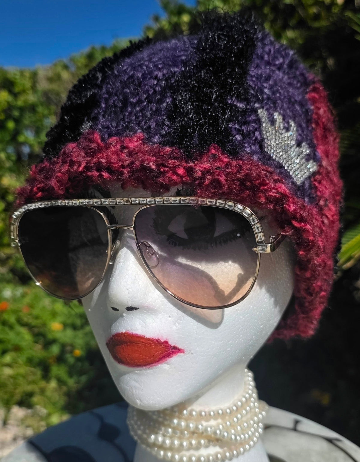 Amethyst Queen Hat on a mannequin, front view showing the rhinestone crown applique